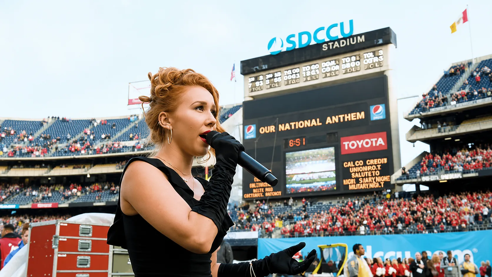 Singer performing the national anthem at SDCCU Stadium before the SDCCU Holiday Bowl football game
