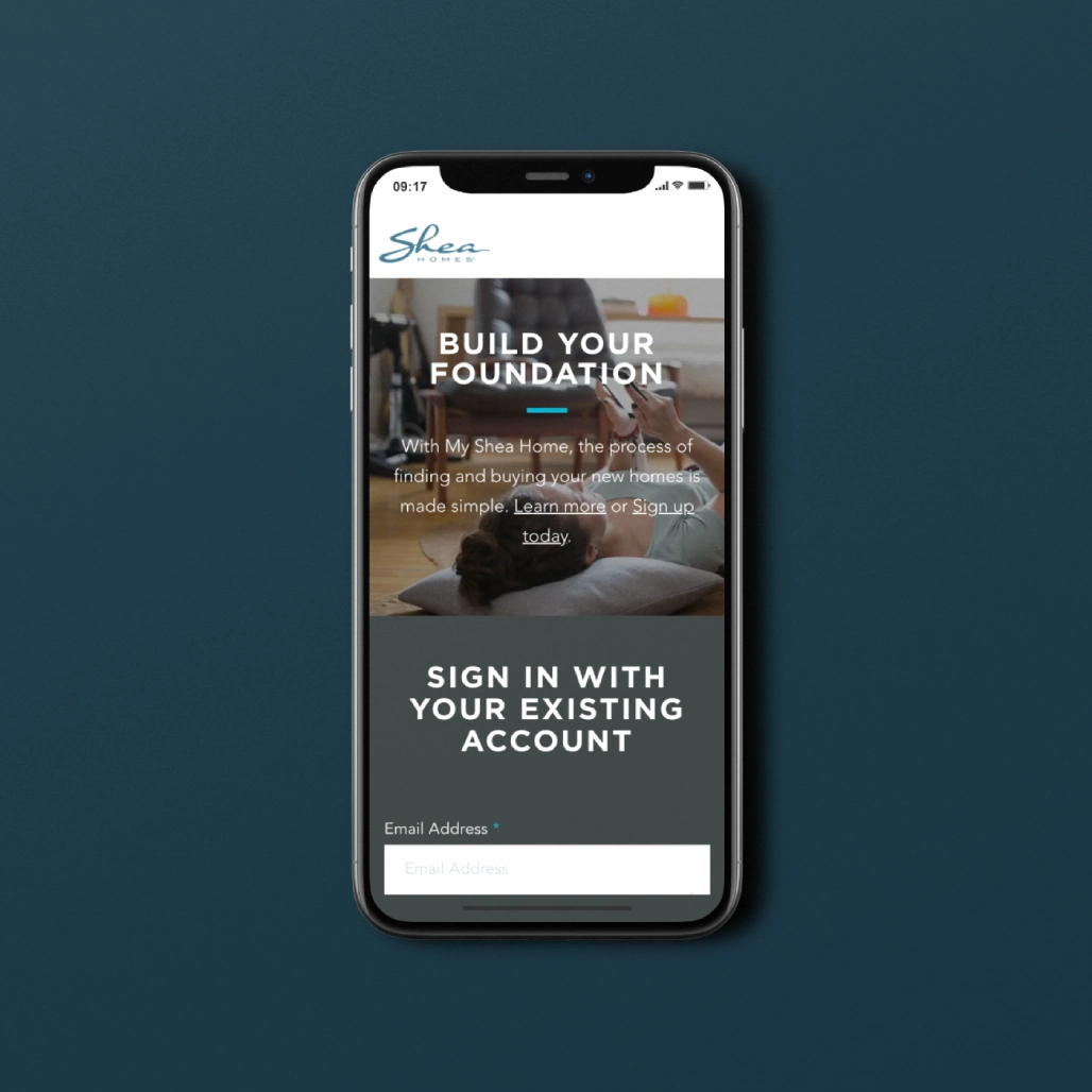 Phone screen showing Shea Homes My Shea Home sign-in page with "Build Your Foundation" messaging
