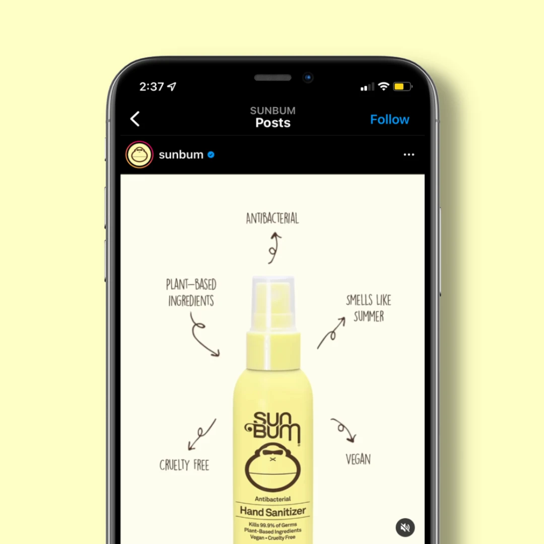 Phone screen showing Sun Bum Instagram post highlighting hand sanitizer features like vegan and cruelty-free