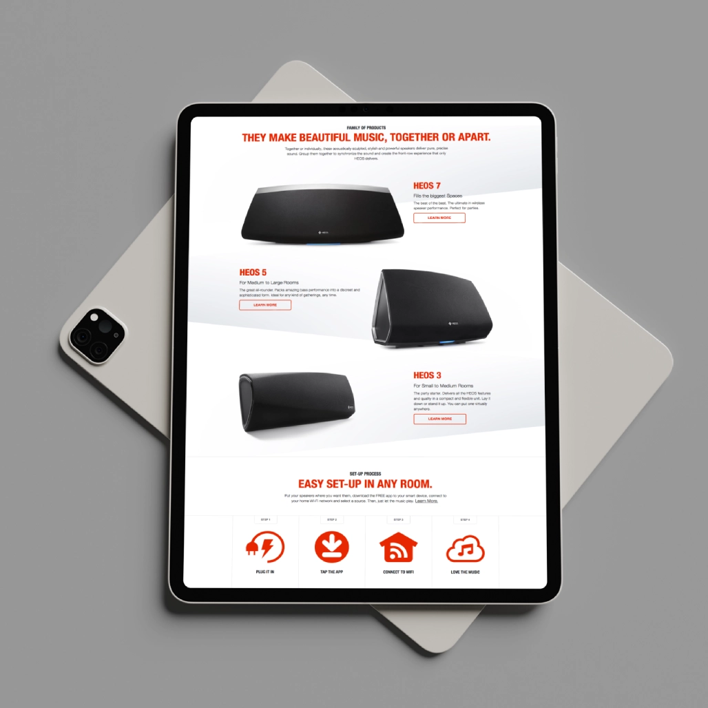 Tablet showing HEOS by Denon product page with HEOS 7, HEOS 5, and HEOS 3 speakers and four-step setup process