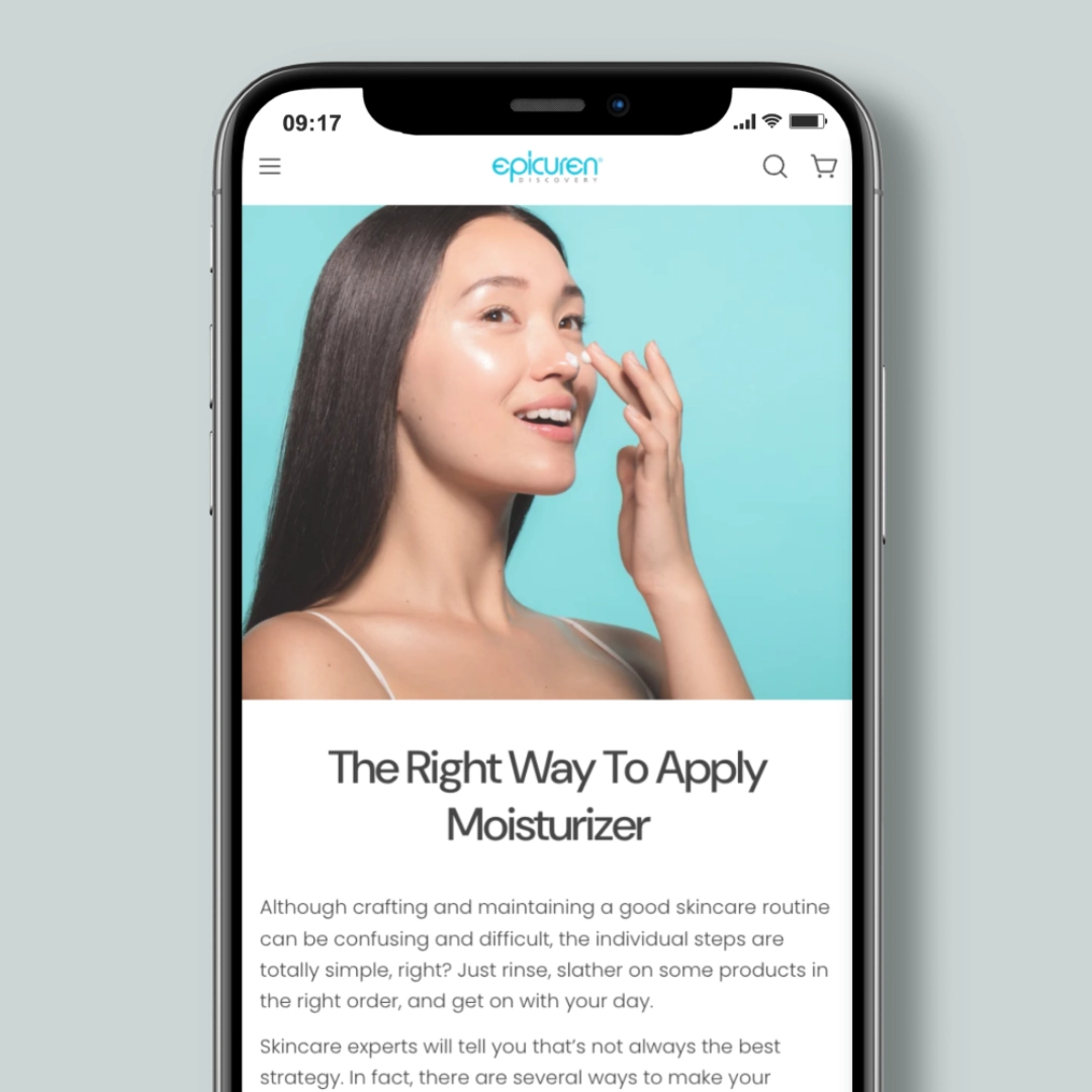 Phone screen showing an Epicuren blog post titled "The Right Way to Apply Moisturizer" with a woman applying cream to her nose