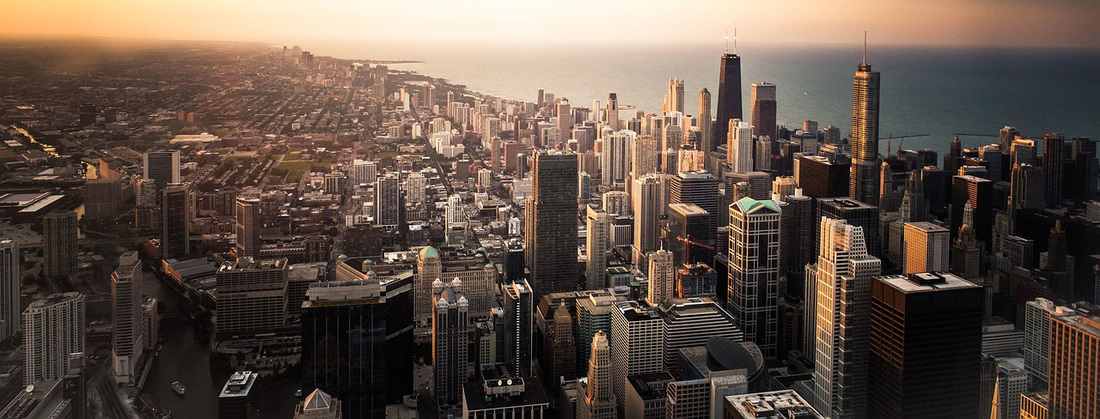 Chicago City sky line. Take a two day bike ride and satisfy your weekend adventure. Explore your Chicago and beyond. The Out Our Front Door organization.