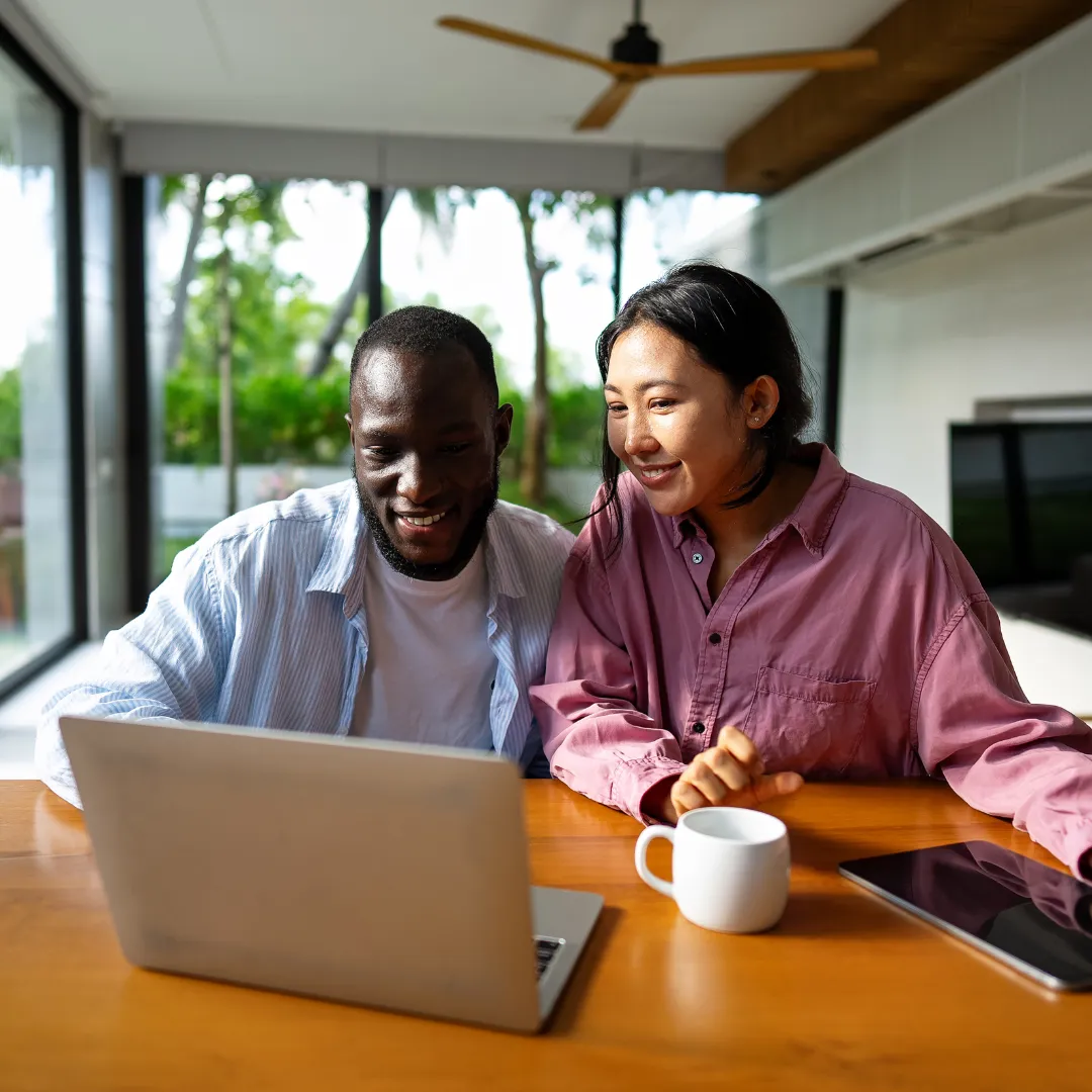 A woman using HouseFacts on a tablet managing her homes