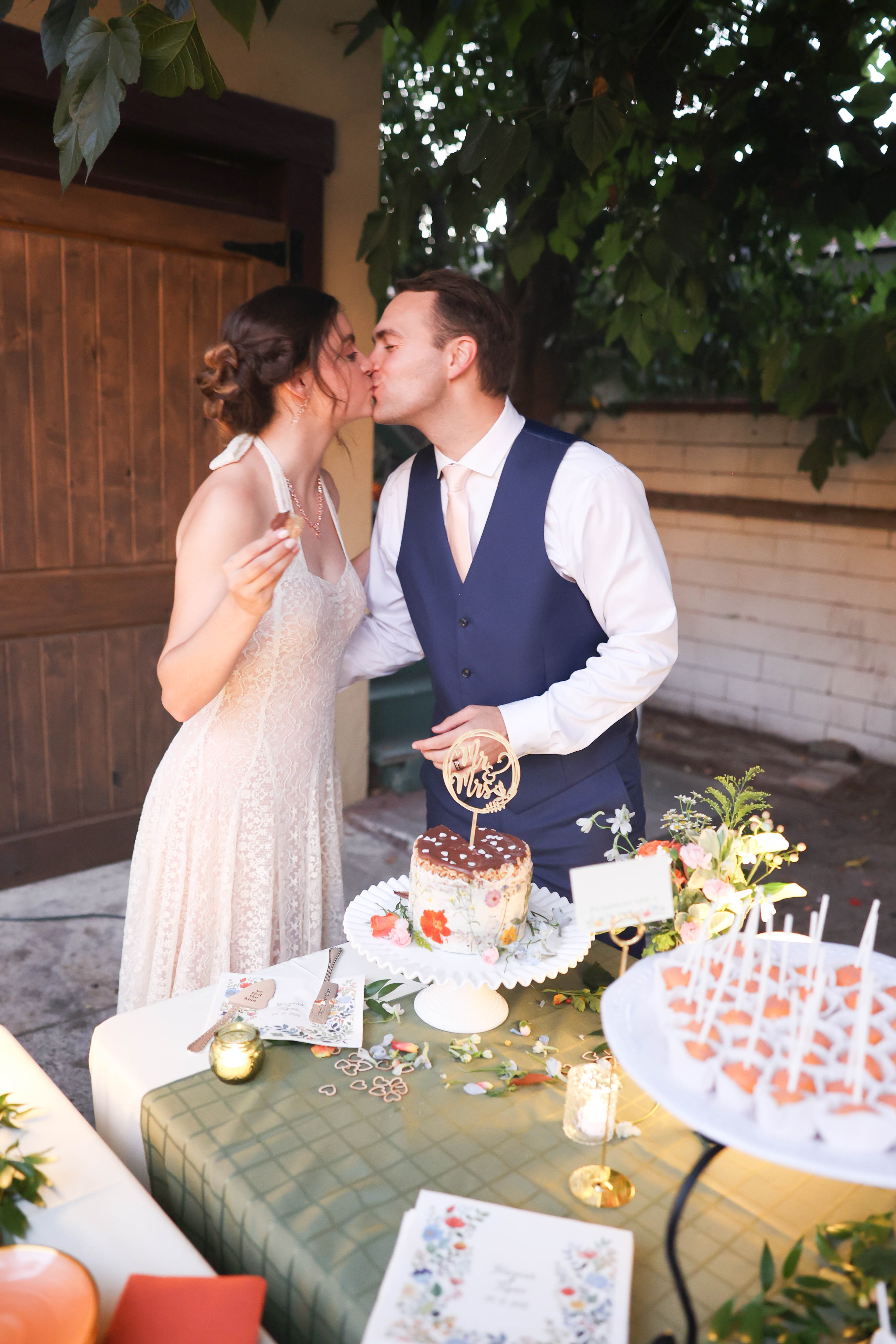 Couple cutting their wedding cake