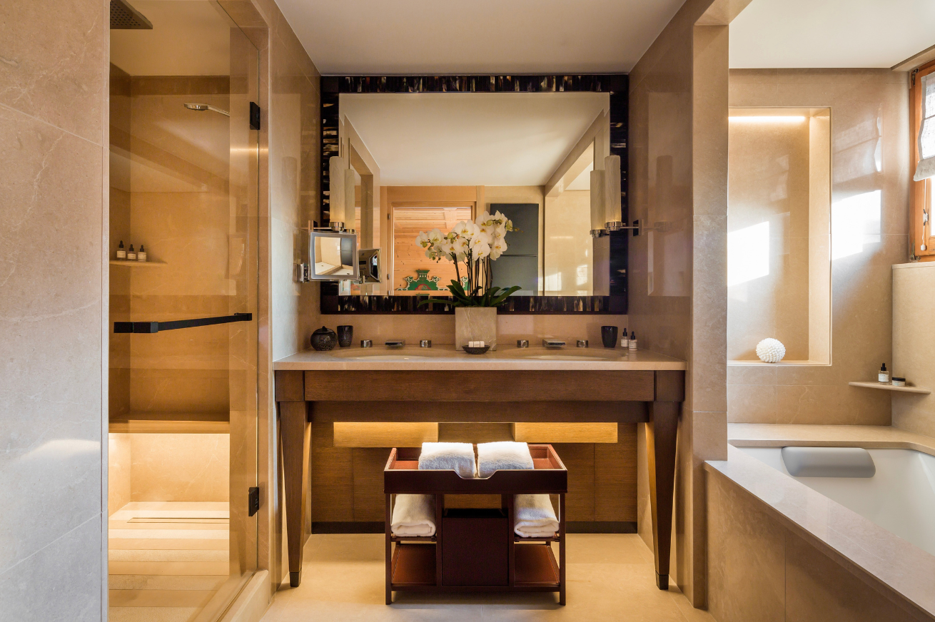 Spacious bathroom in a luxury hotel in Haute-Savoie, with high-end finishes and mountain views