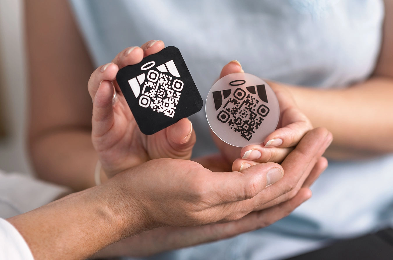 a couple holding memoriv stickers