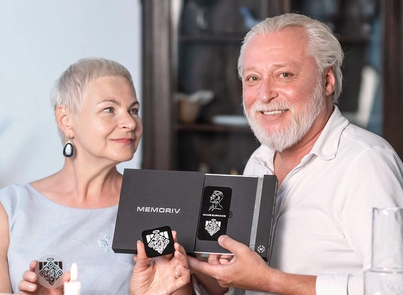 an old couple with memoriv stickers