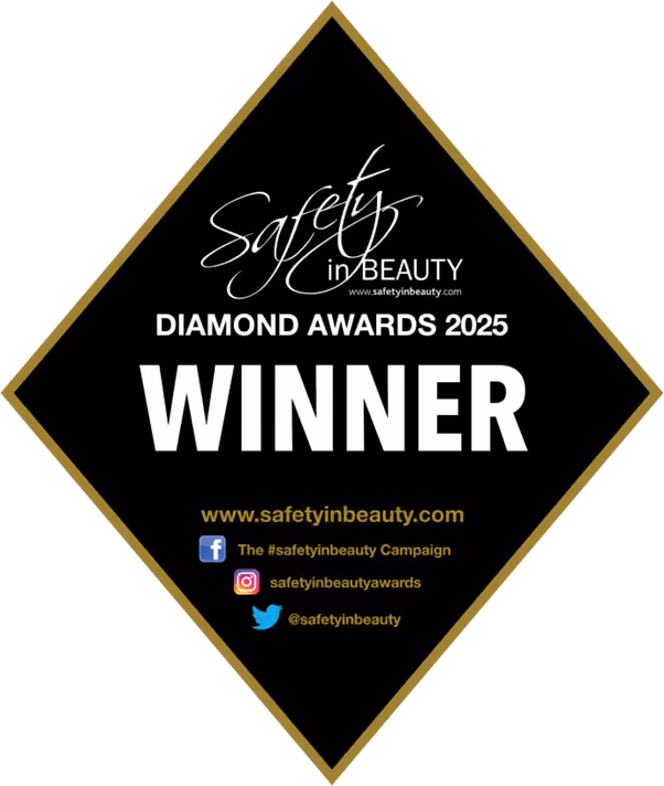 Safety in Beauty Diamond Awards 2025 winner black diamond-shaped badge with gold border and social media info.
