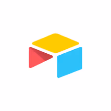 Colorful abstract three-dimensional geometric shapes in yellow, red, and blue on a white background.