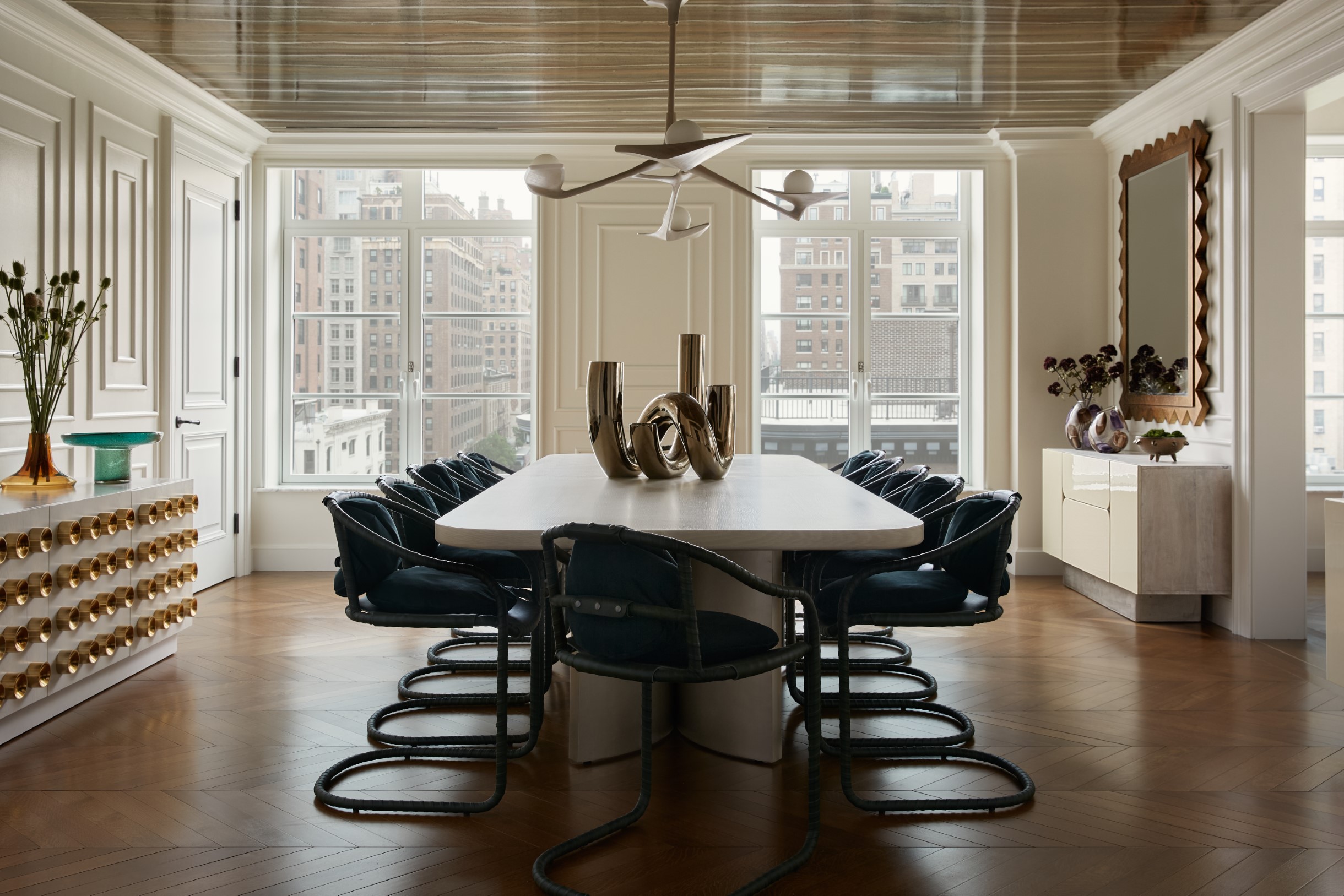 Dining room with a Pearl Chandelier designed and built by Vlad Krasnogorov hanging over the dining table. Interior design by Widell + Boschetti, photography by Brian Wetzel.