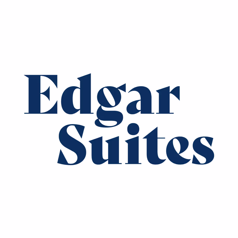 Edgar Suites logo text in dark blue serif font on white background.