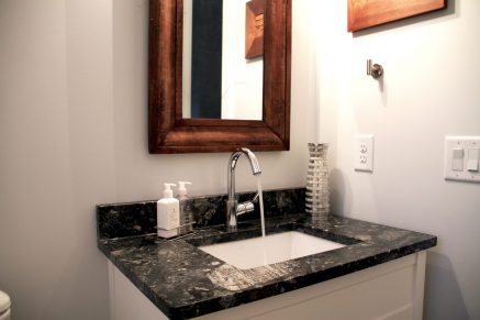 Harvested rainwater coming out of a bathroom faucet. Use rainwater like you would any other water!