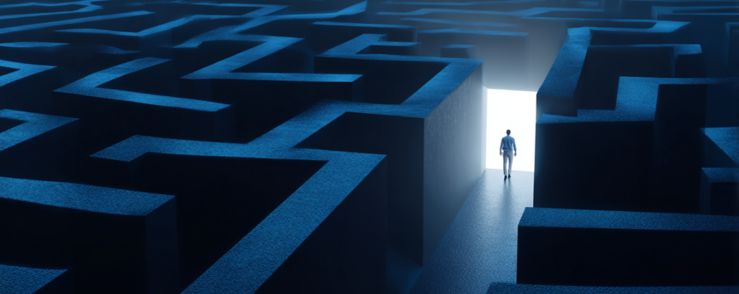Person walking through a maze toward a bright exit, symbolizing clarity and direction in brand strategy
