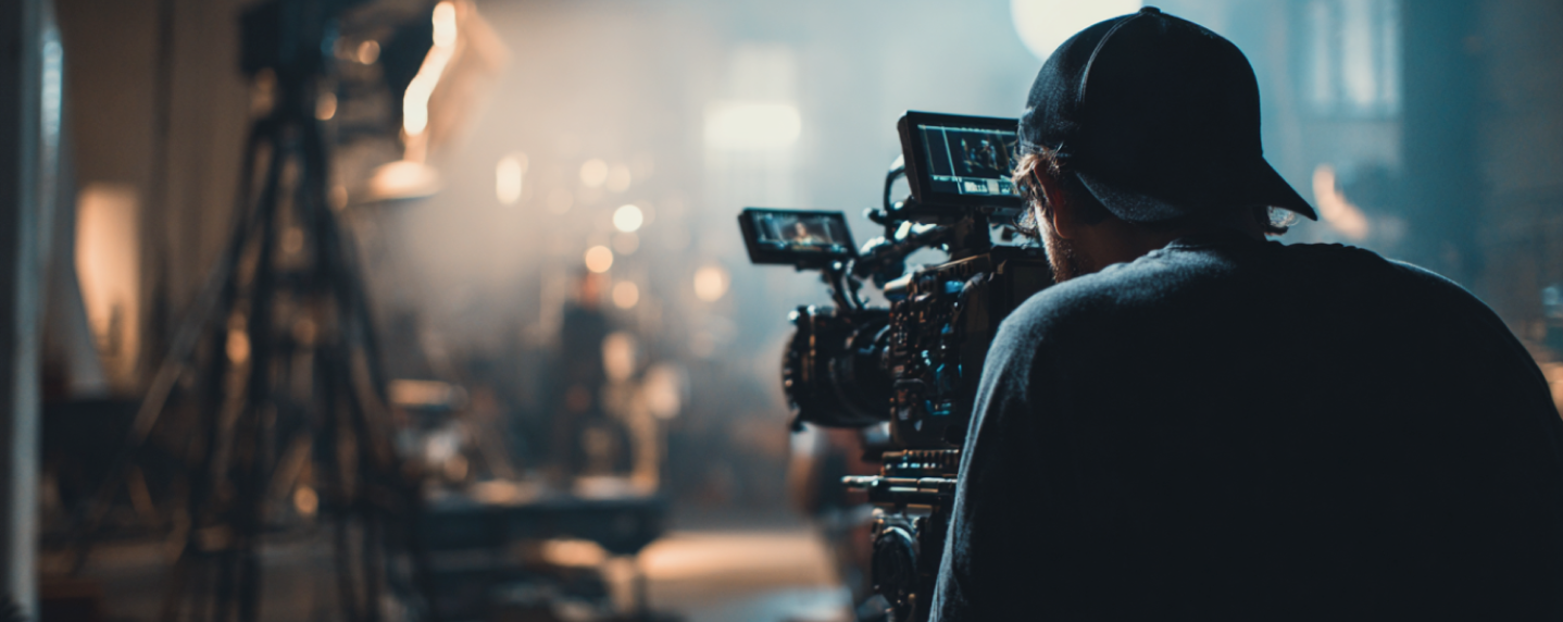 Cinematographer filming on set with a professional camera, capturing high-quality video content for digital brand storytelling