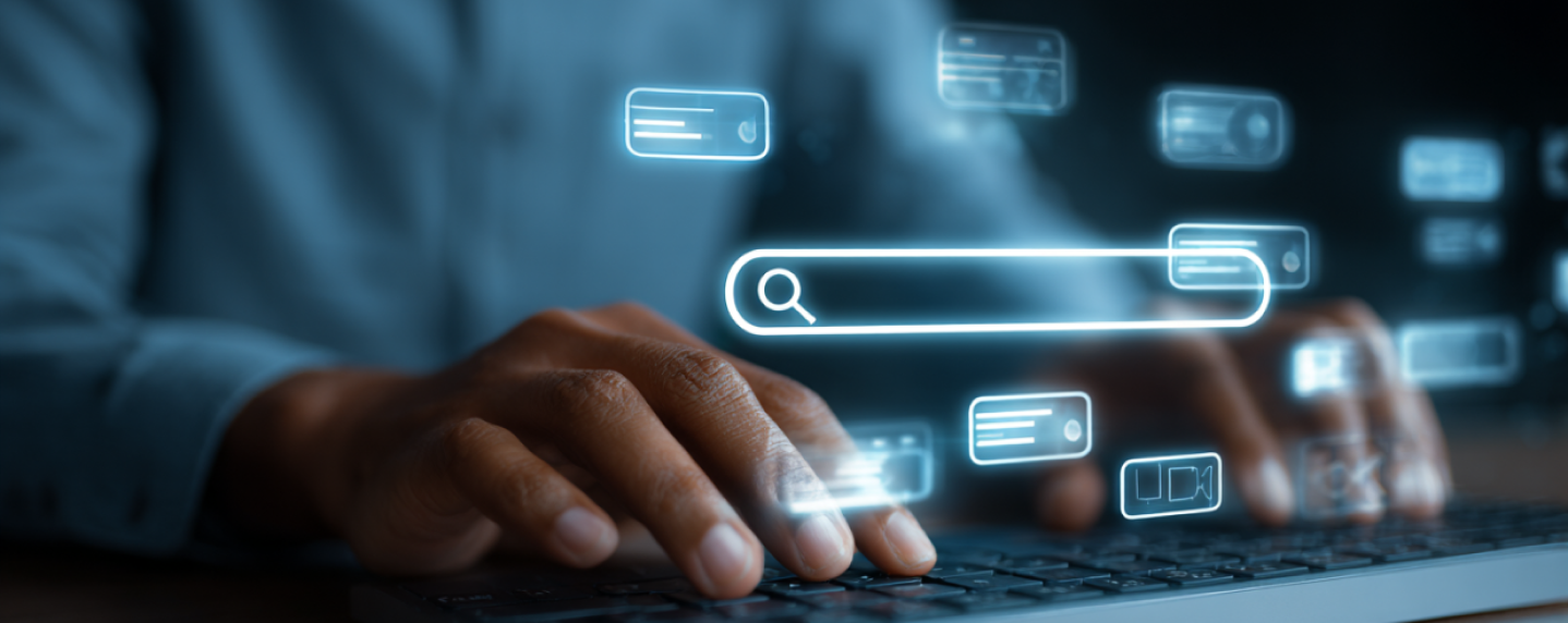 Hands typing on a keyboard with glowing digital search icons, representing paid search (PPC) marketing and online ad targeting