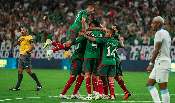 Sports Activation & Events image of a team jumping in a huddle to celebrate a goal.