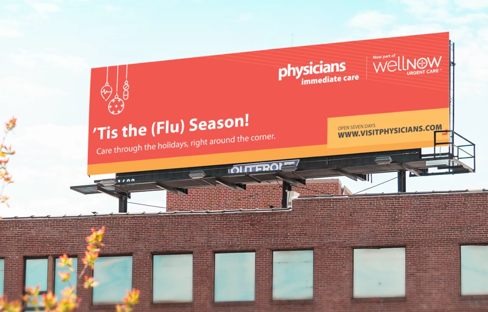 A billboard displays a creative ad for WellNow Urgent Care.