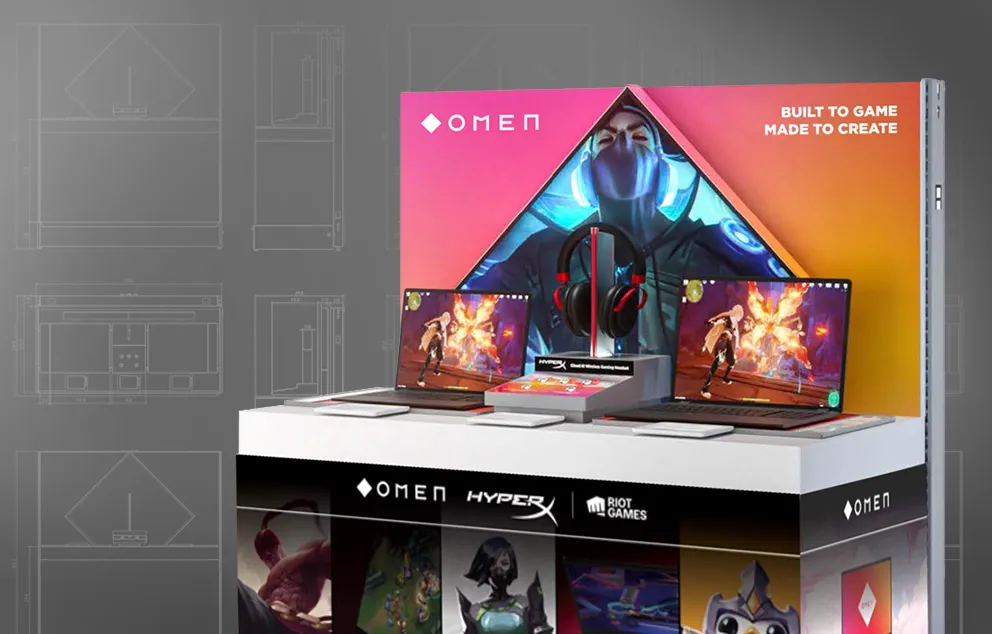 Rendering of a retail endcap display for two laptops and a gaming headset. Images from popular games are visible on the backwall and shelf wrap