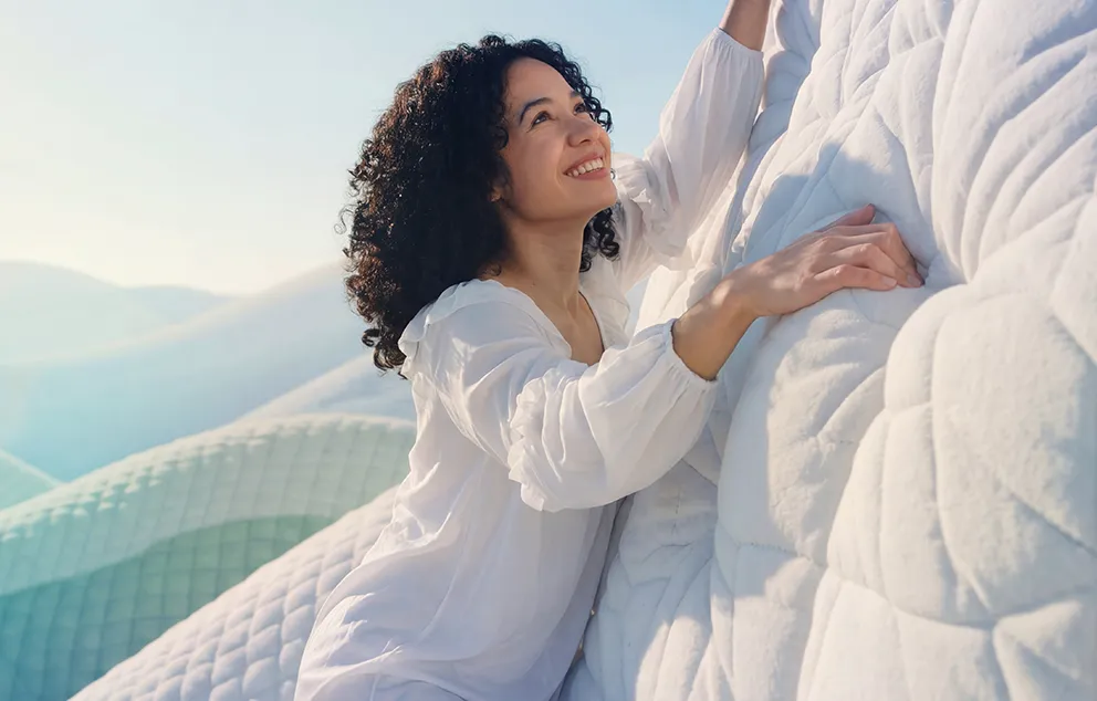 Image of a woman on a blanket, as part of a successful brand development campaign for a mattress company.