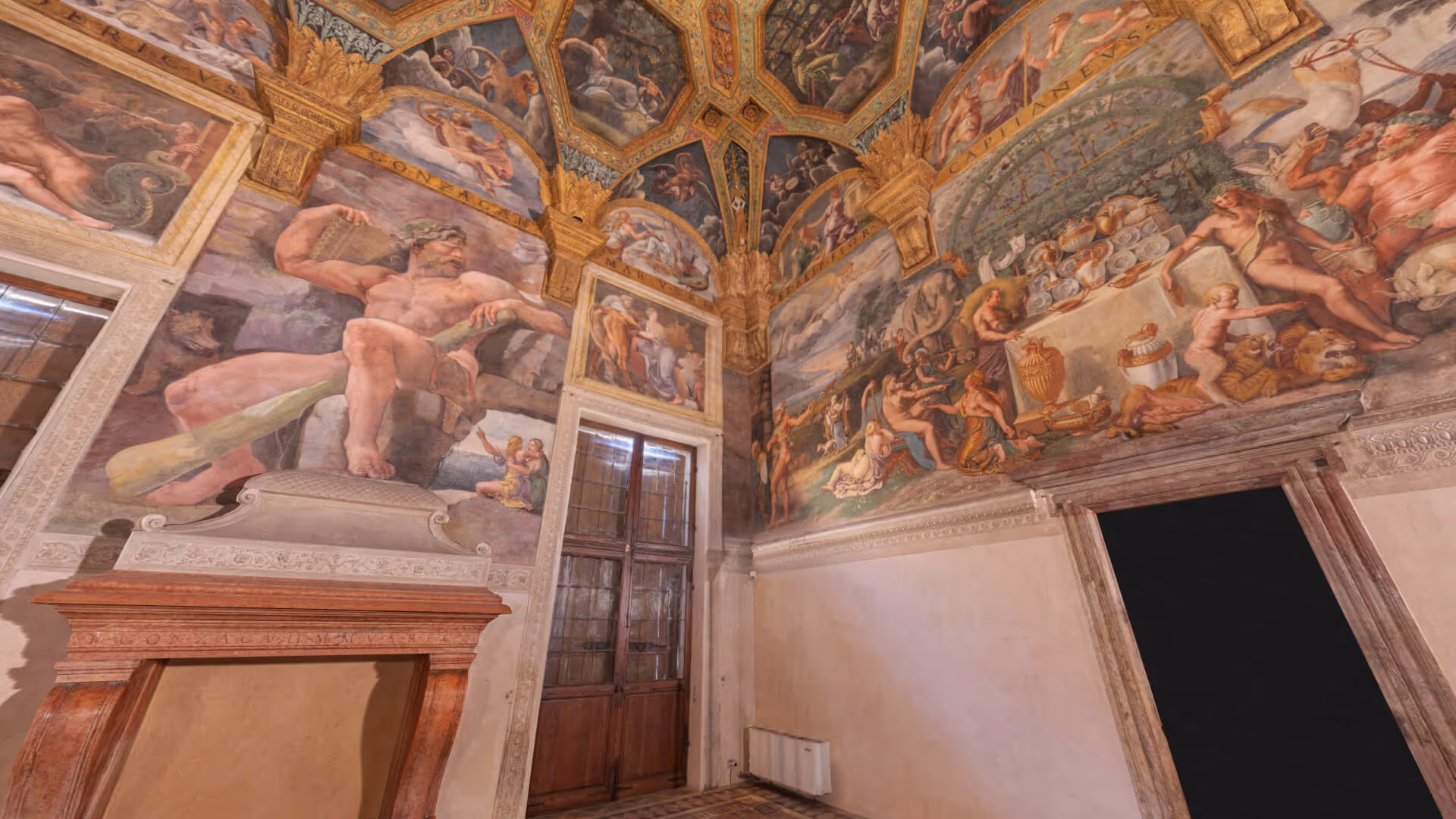 MUD Foundation Giulio Romano’s Sala di Psiche in Verse, featuring a Renaissance-style interior covered in intricate frescoes depicting mythological and classical scenes, human figures, and decorative motifs.