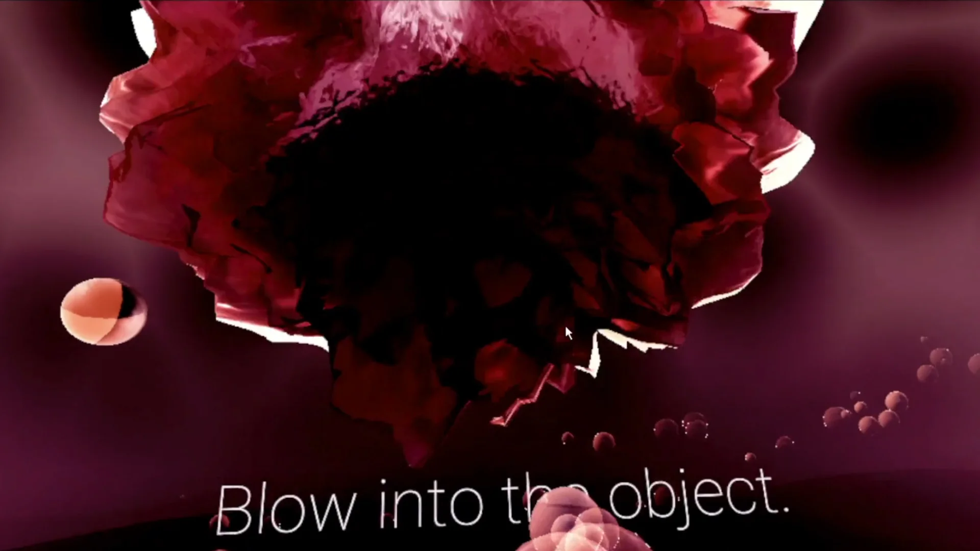 MUD Foundation Phivos-Angelos Kollias’s *Cosmodemonia*, 2022, featuring a surreal red and black digital environment with floating spheres and a large abstract form accompanied by the text “Blow into the object.”
