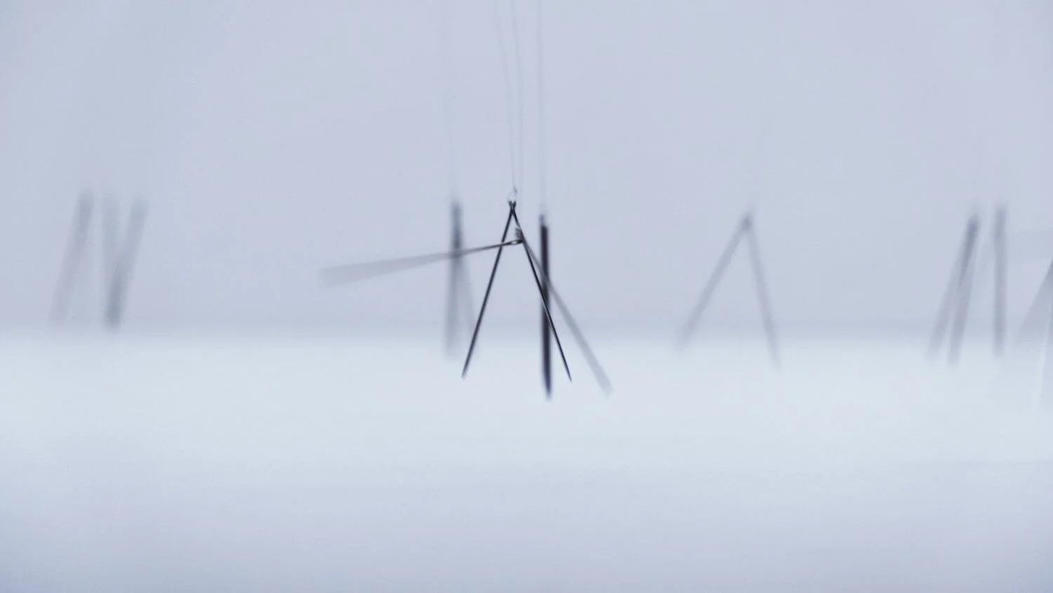 MUD Foundation Alba Triana’s *Entropic Ballet*, 2021, featuring abstract black line forms suspended against a pale background, with blurred repeated shapes creating a sense of motion.