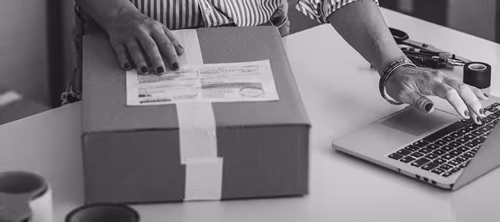 A retail business owner working on an online order