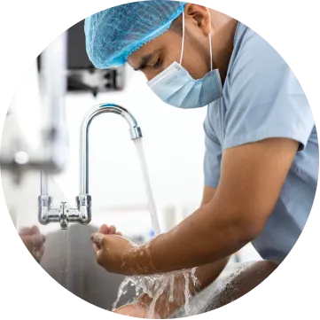 A surgeon washing their hands