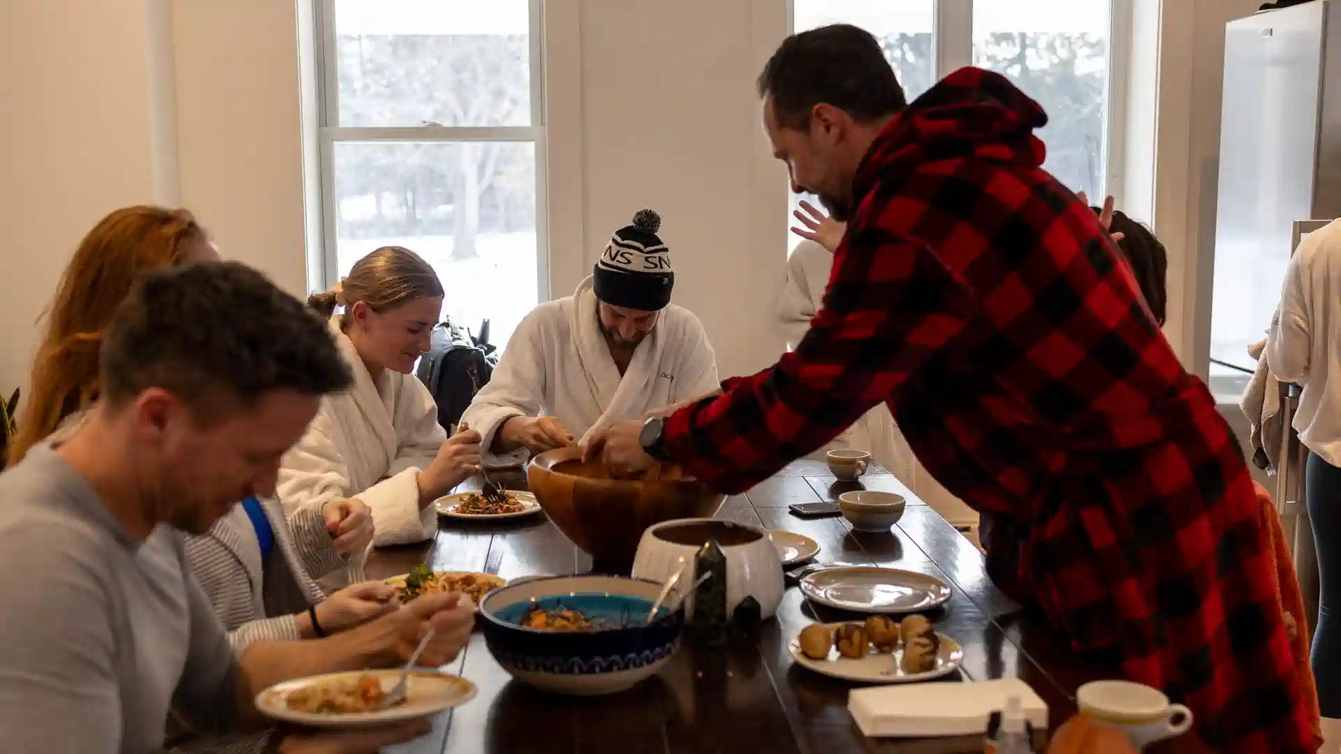 Team-Enjoying-a-Group-Meal-Vildhus-Retreat-Centre-Ontario.webp