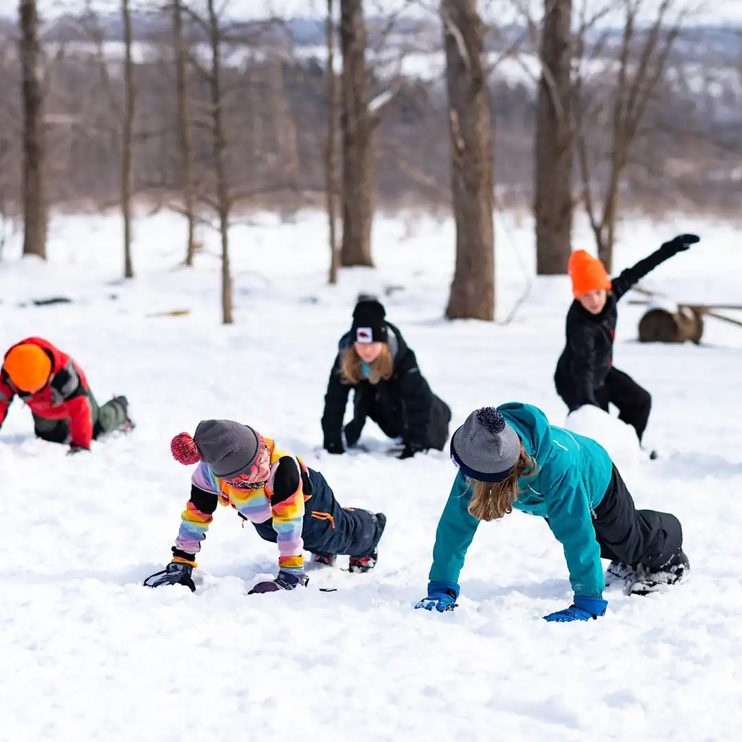 students-doing-pushups-in-snow-winter-blue-mountain-wild-school.webp