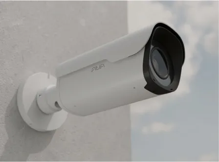 A white Ava camera is mounted on a wall.