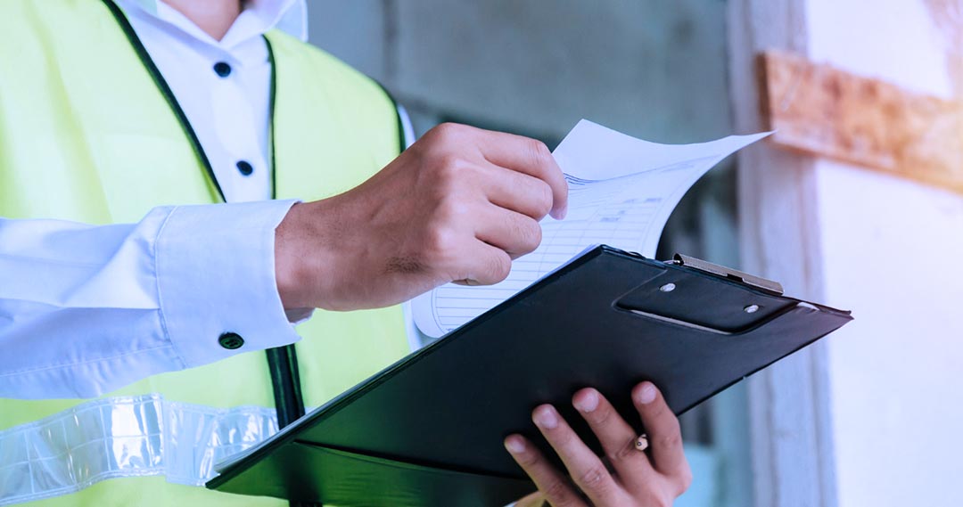 An electrical inspector at an EV charging site