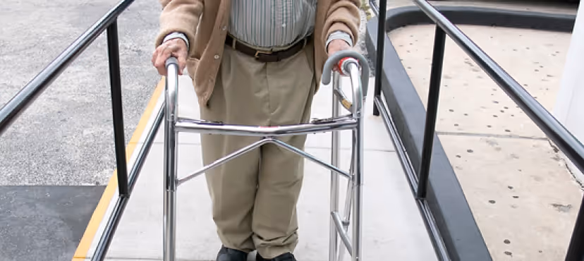This image is representing home safety assessments with and old man with walking chair in the image