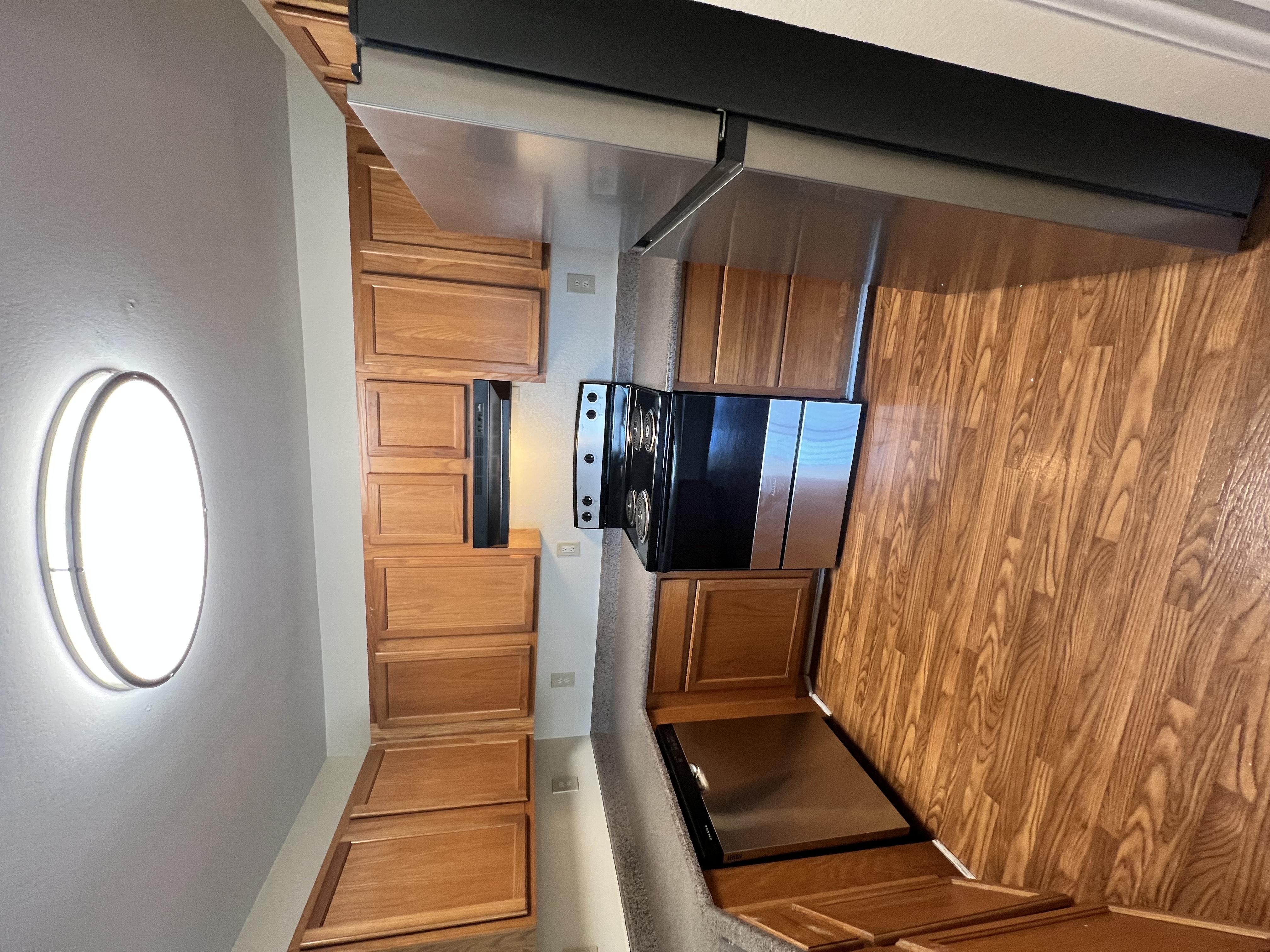 Kitchen with brown cabinets