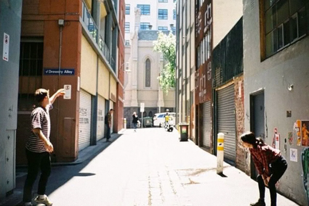 Two people standing in the alley outside the coffee shop at 12 Drewery Lane Melbourne