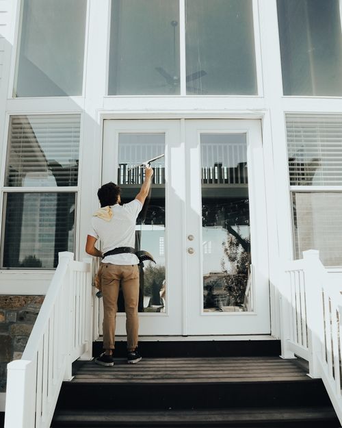 Outside cleaning back door window panes