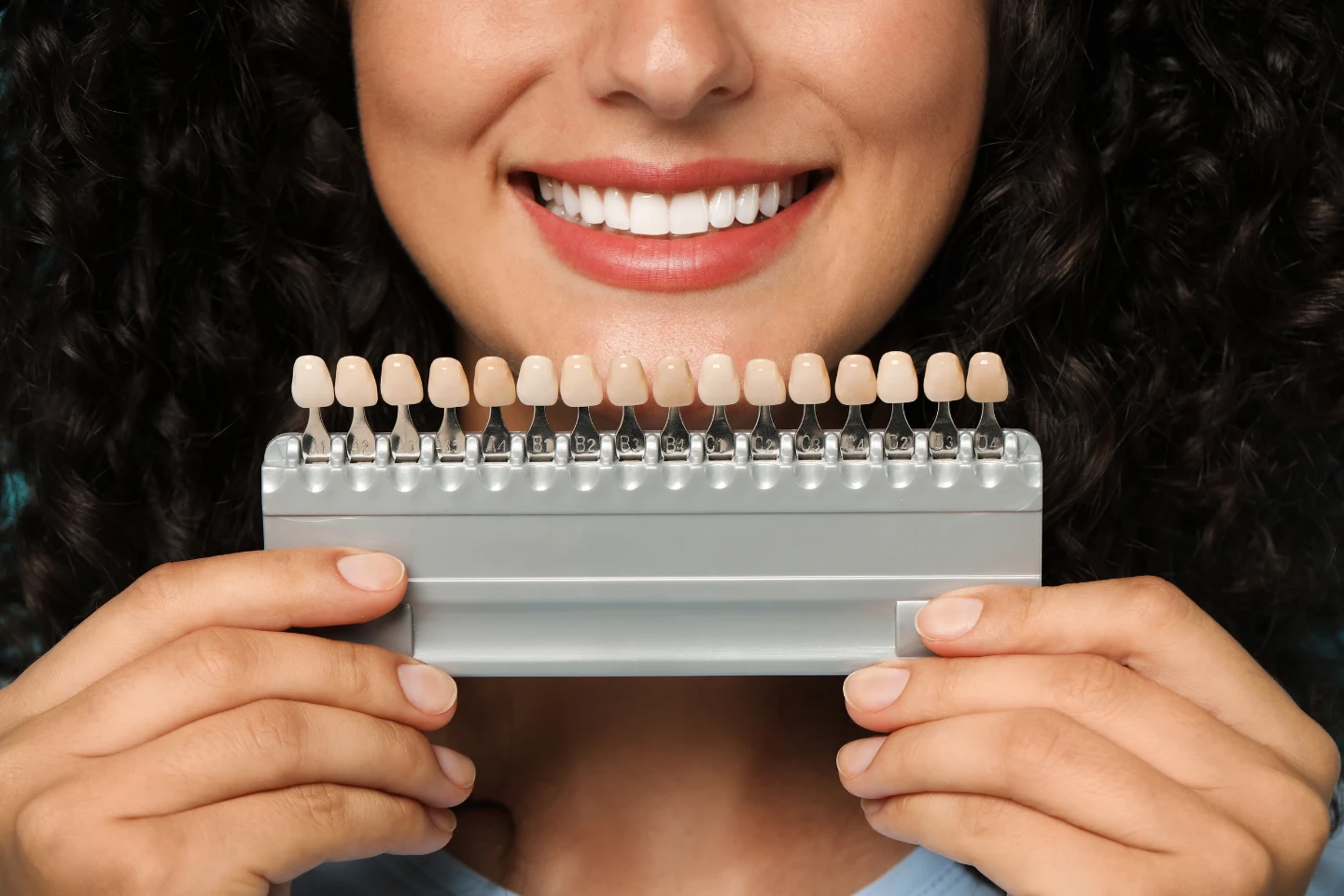 woman holding veneers