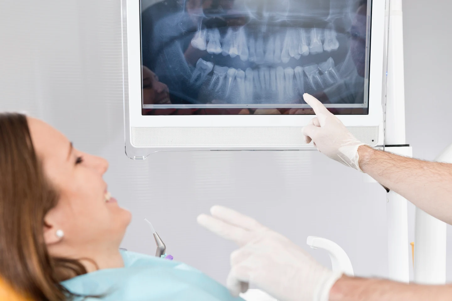 dentist showing x-ray to patient