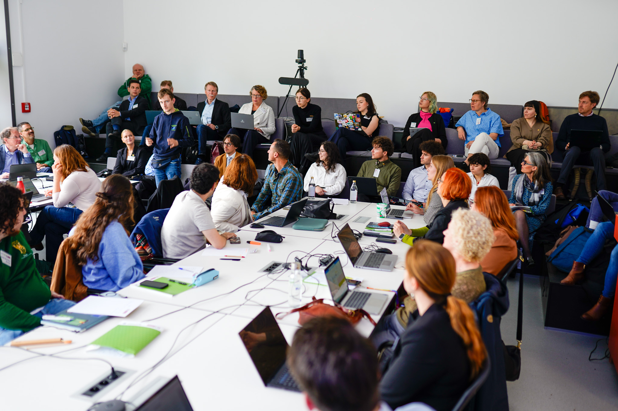full meeting room with students and alliance representatives