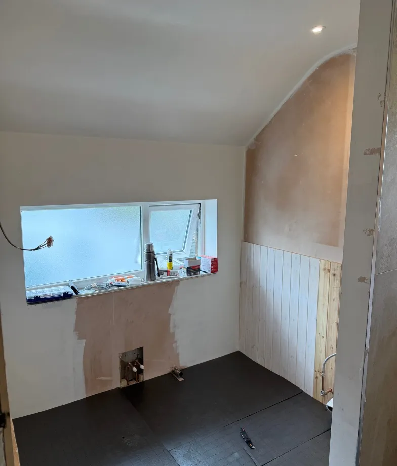 Bathroom with floral wall design and soft pastel decor