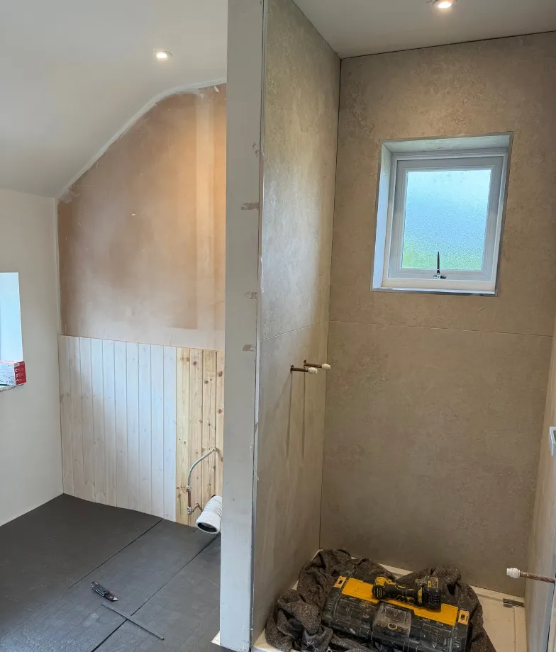 Bathroom interior with soft floral wall design and elegant fixtures