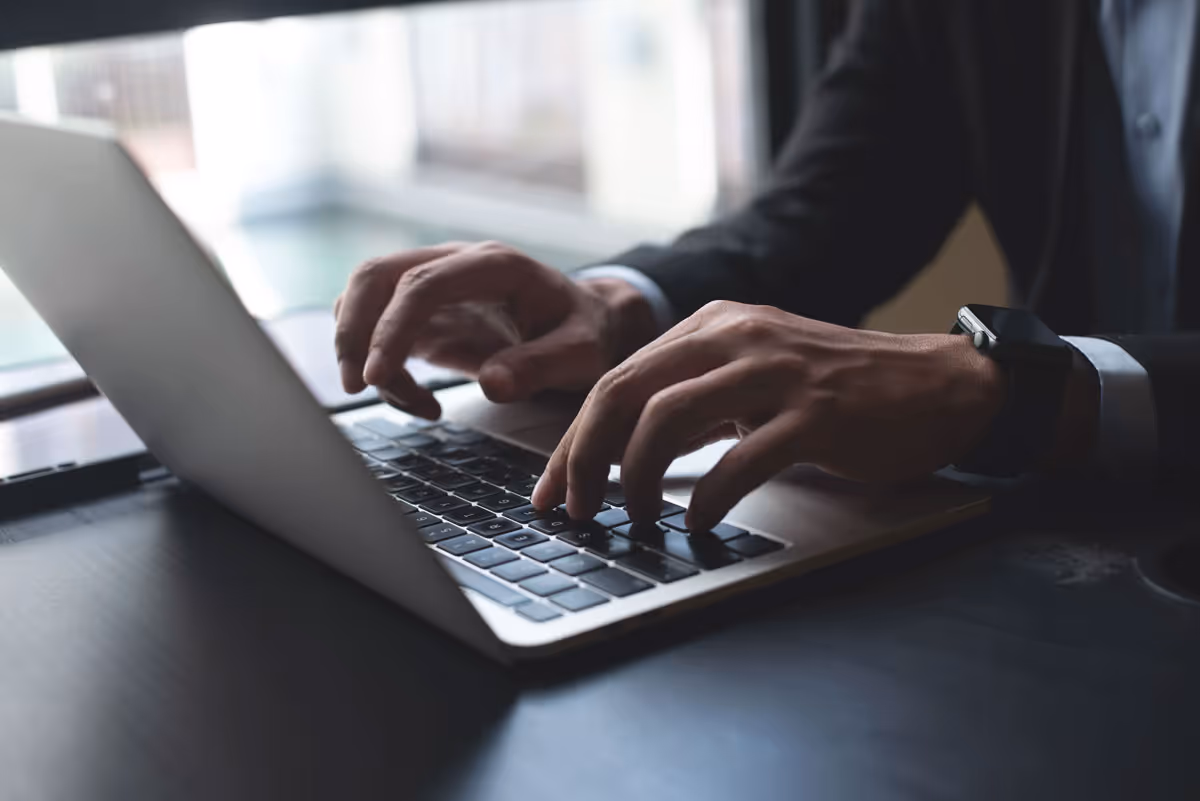 Business professional working on laptop.
