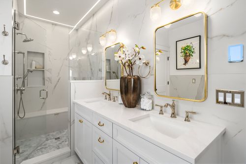 Professionally installed large format tile in a primary bathroom