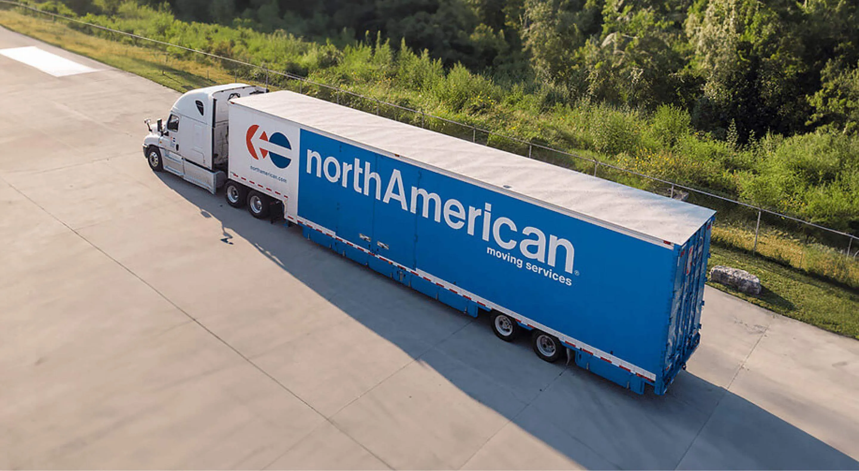 Moving truck driving on highway