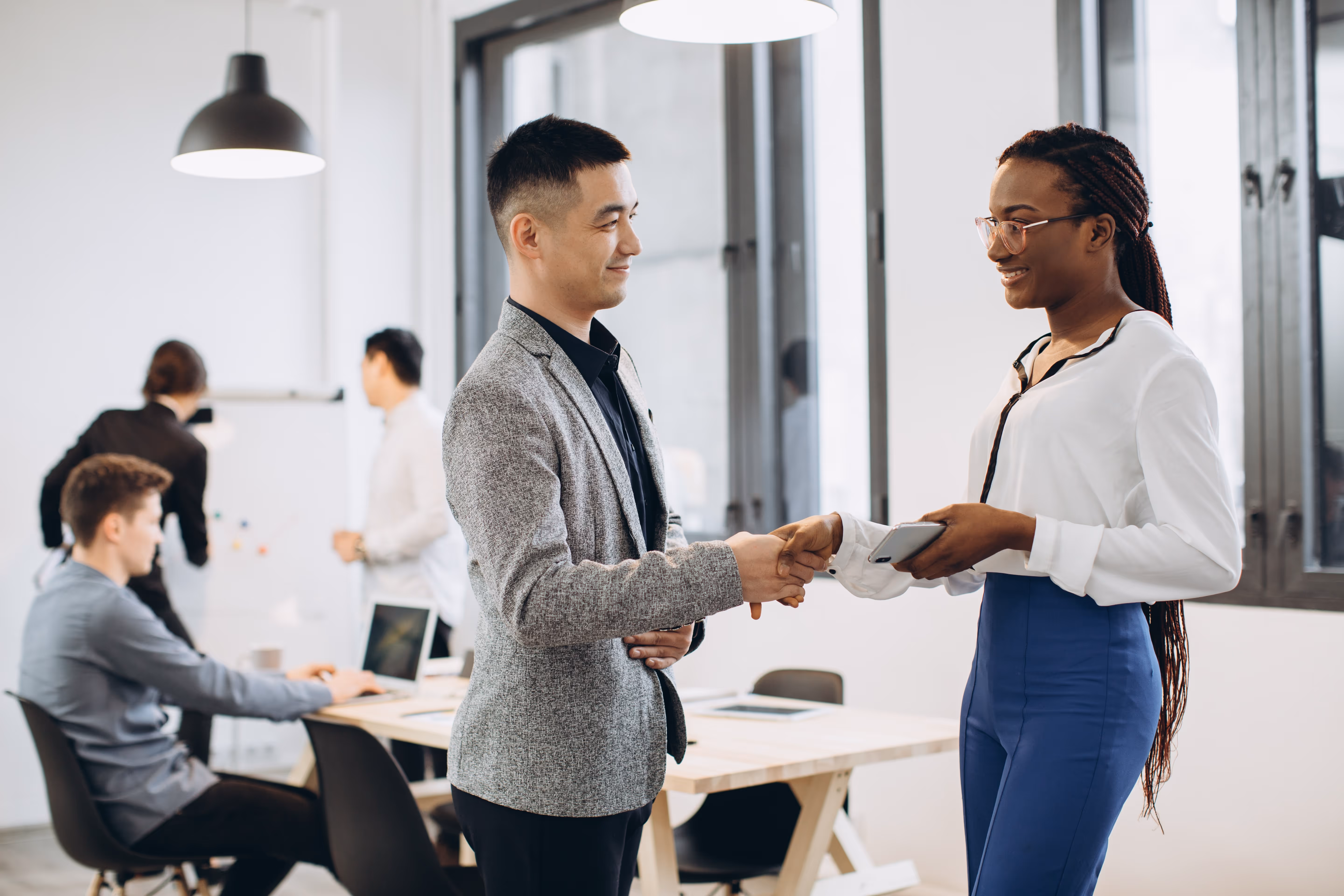 Business man and woman shaking hands