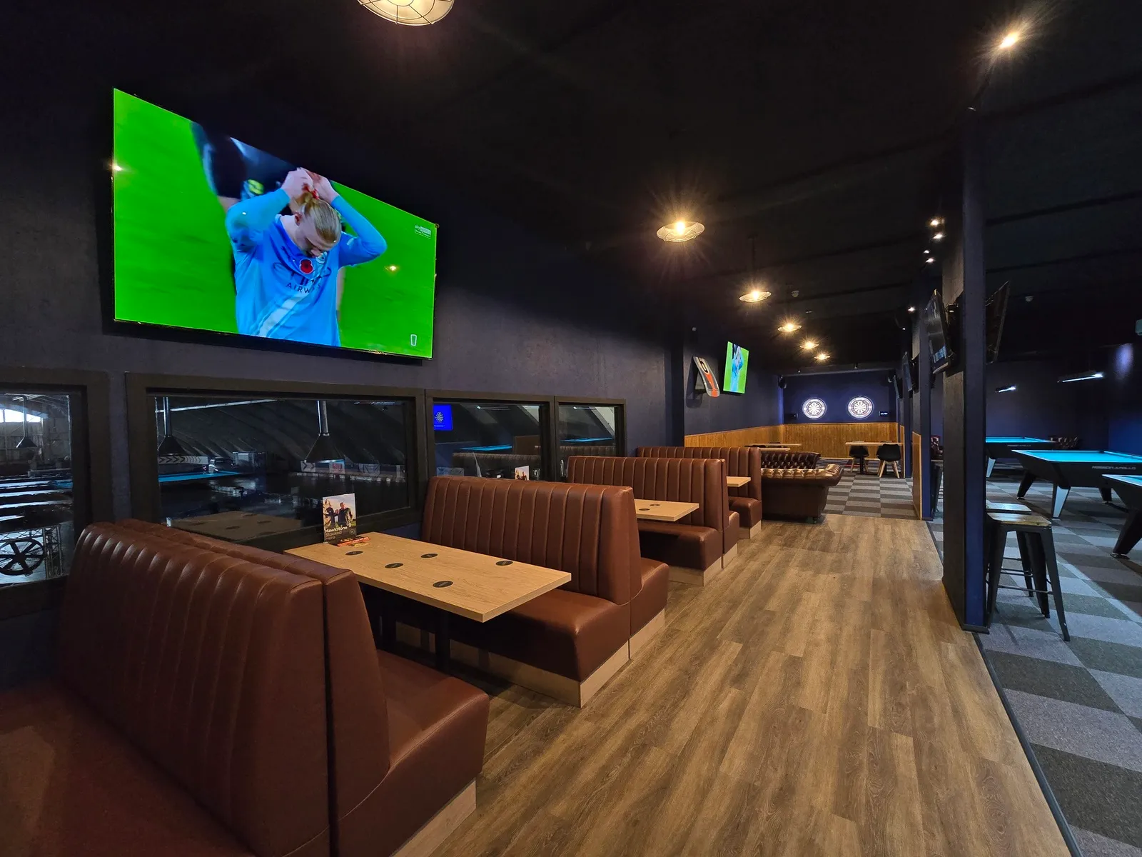 Apex Lounge bar seating with TV screens