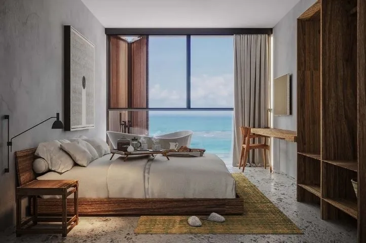 Photo d’une chambre de l’hôtel Ibitu Gostoso, représentant l’élégance et le confort balnéaire pensés par Momerable.