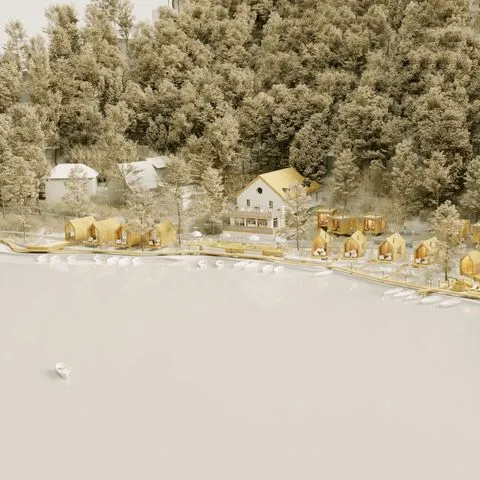 Vue aérienne du lac bordant le site de Maison Monsieur, illustrant l’environnement naturel d’exception intégré au projet conçu par Momerable.