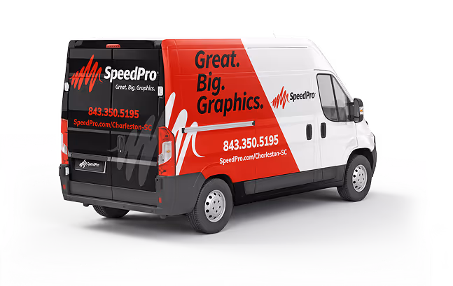 Charleston SpeedPro van with branded wrap showcasing large-format printing and graphics services.