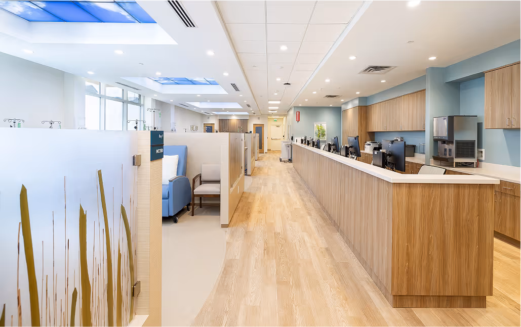Bright, modern medical office with wooden floors and blue skylights